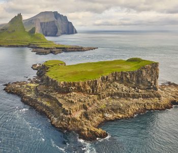 Faroe islands dramatic coastline viewed from helicopter. Vagar area
